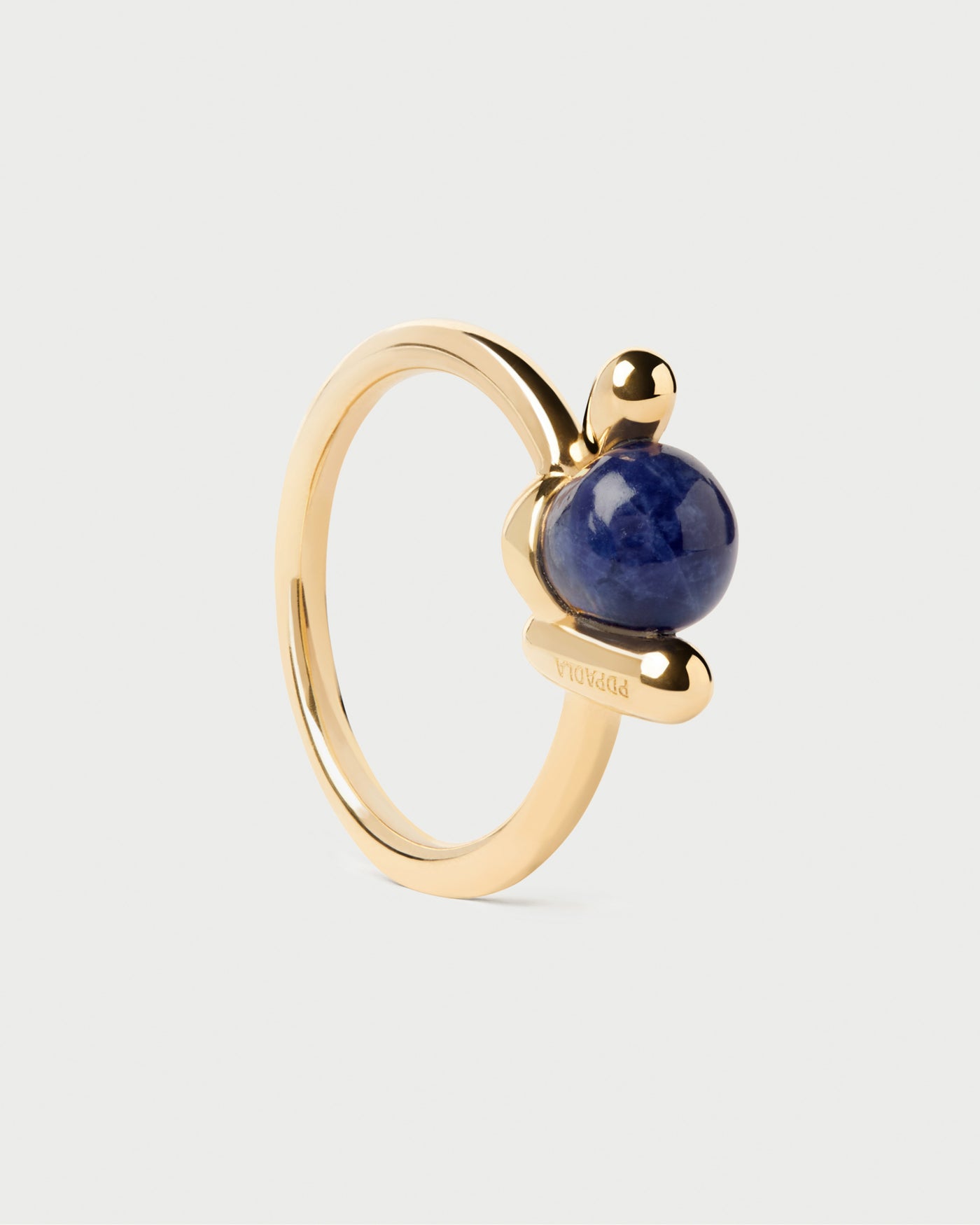 Sodalite Nexus ring. Fluid open knot ring inlaid with a round hand-carved royal blue gemstone. Get the latest arrival from PDPAOLA. Place your order safely and get this Best Seller.