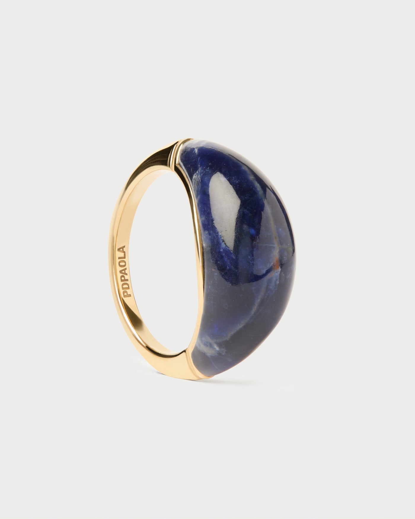 Sodalite Cosmos stamp ring. Chunky stamp ring topped with an oval hand-carved royal blue gemstone. Get the latest arrival from PDPAOLA. Place your order safely and get this Best Seller.