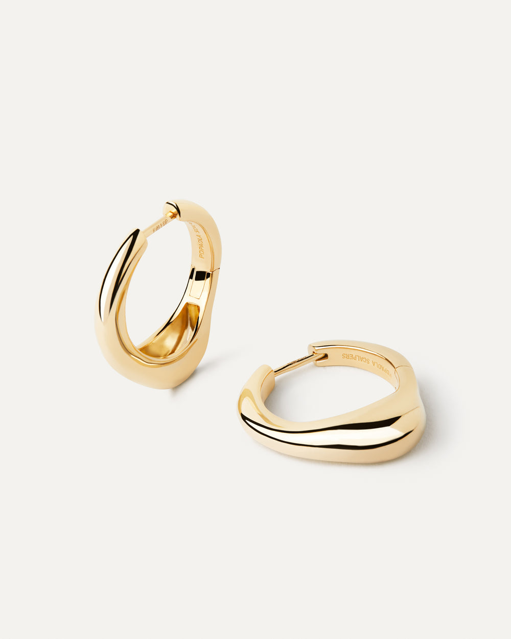 Gold-plated organic shape big hoops with a fluid design | Riba Hoops ...