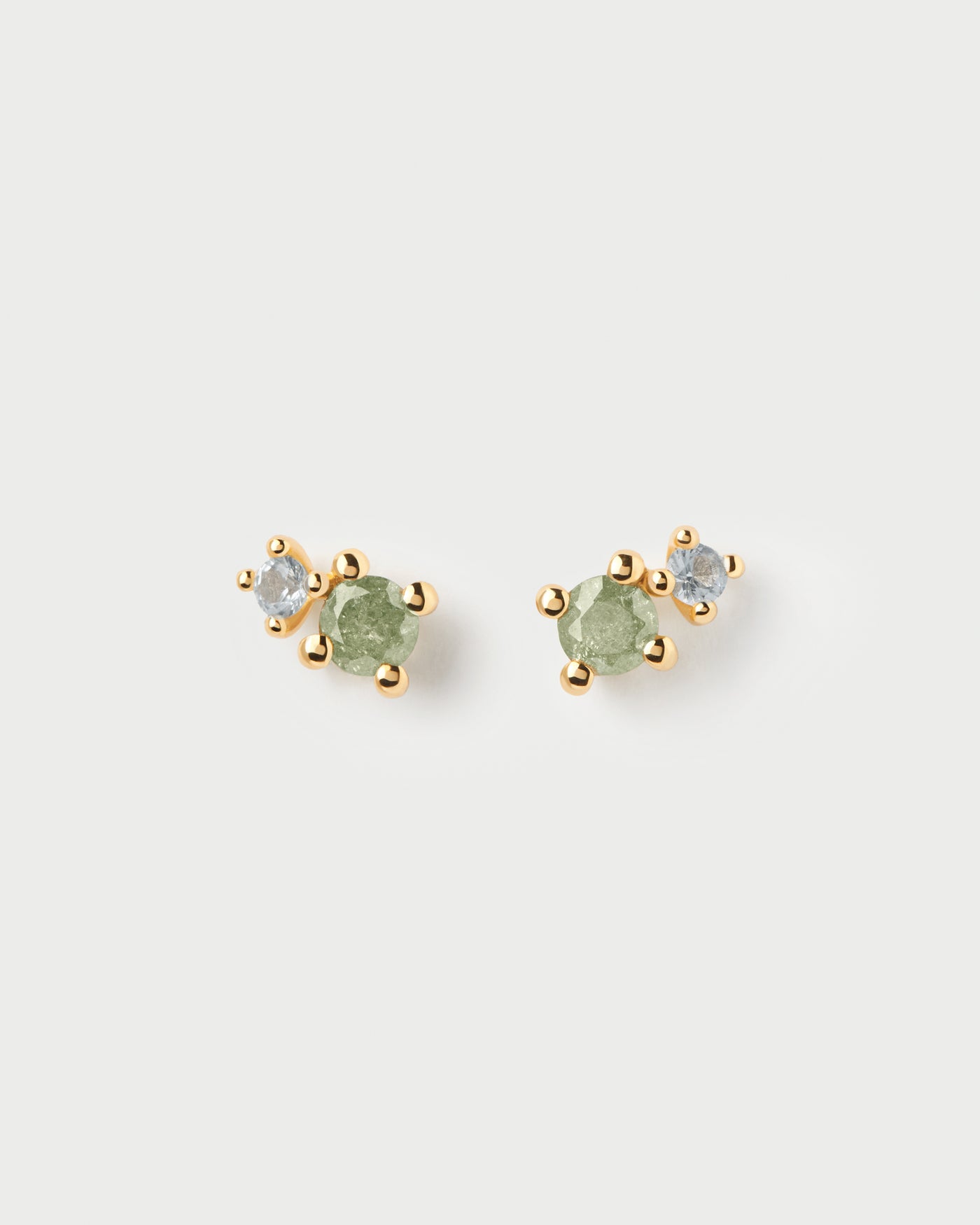 Pendientes asimétricos redondos adornados con circonitas verde hielo y azul