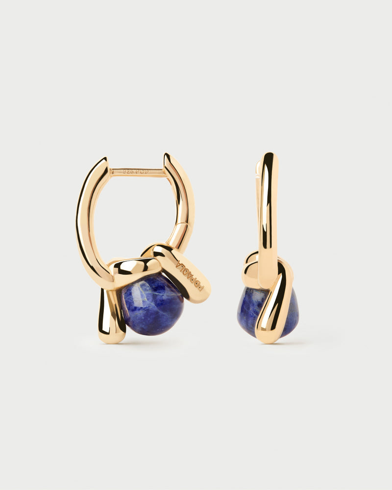 Fluid open knot hoop earrings inlaid with a hand-carved royal blue gemstone pendant