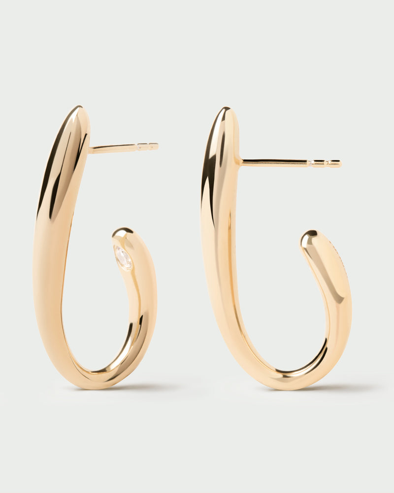 Gold-plated modern semi hoops accented with a round white zirconia