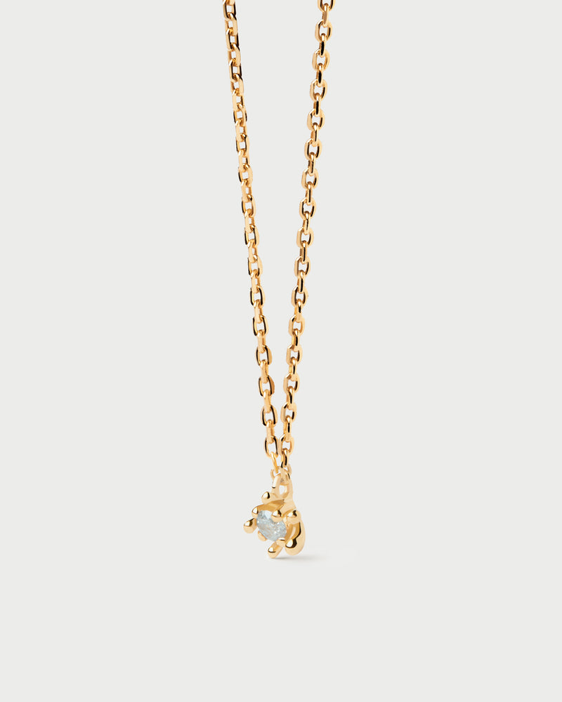 Sleek chain necklace set with grey zirconia surrounded by golden multi-prong setting