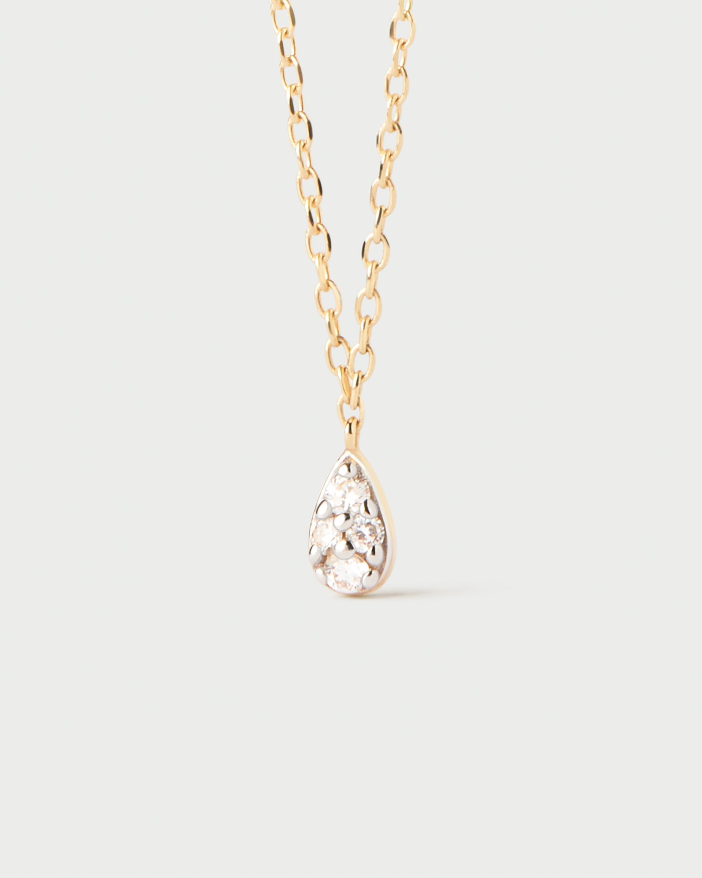 Diamonds and gold Rio solitary necklace. 18K yellow gold minimal solitary chain necklace with pavé lab-grown diamond drop pendant. Get the latest arrival from PDPAOLA. Place your order safely and get this Best Seller.