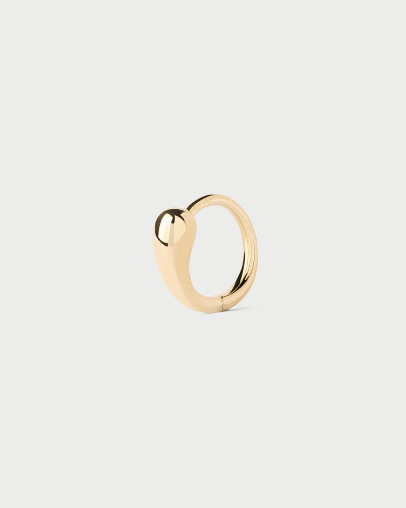 Mini single huggie hoop featuring sculptural drop-shaped motif and hidden closure