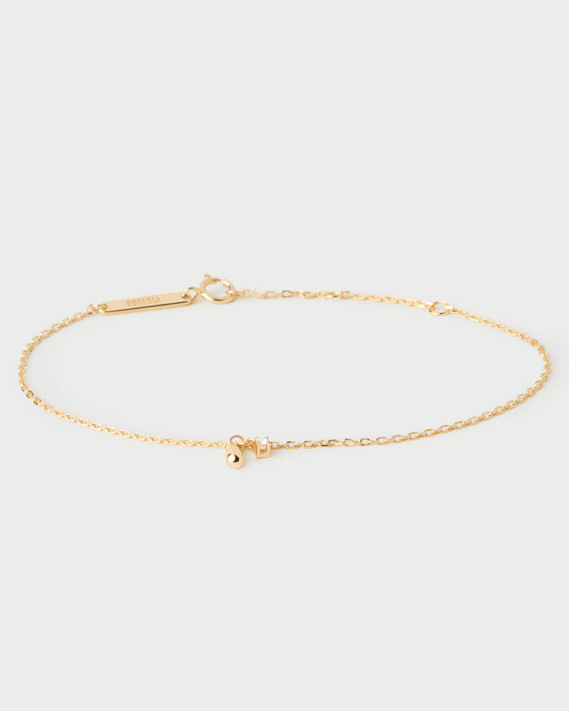 Dainty chain bracelet with a round cubic zirconia and a drop pendant