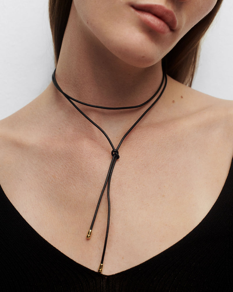 Dana leather bow necklace - 
  
    Leather / 18K Gold plating
  
