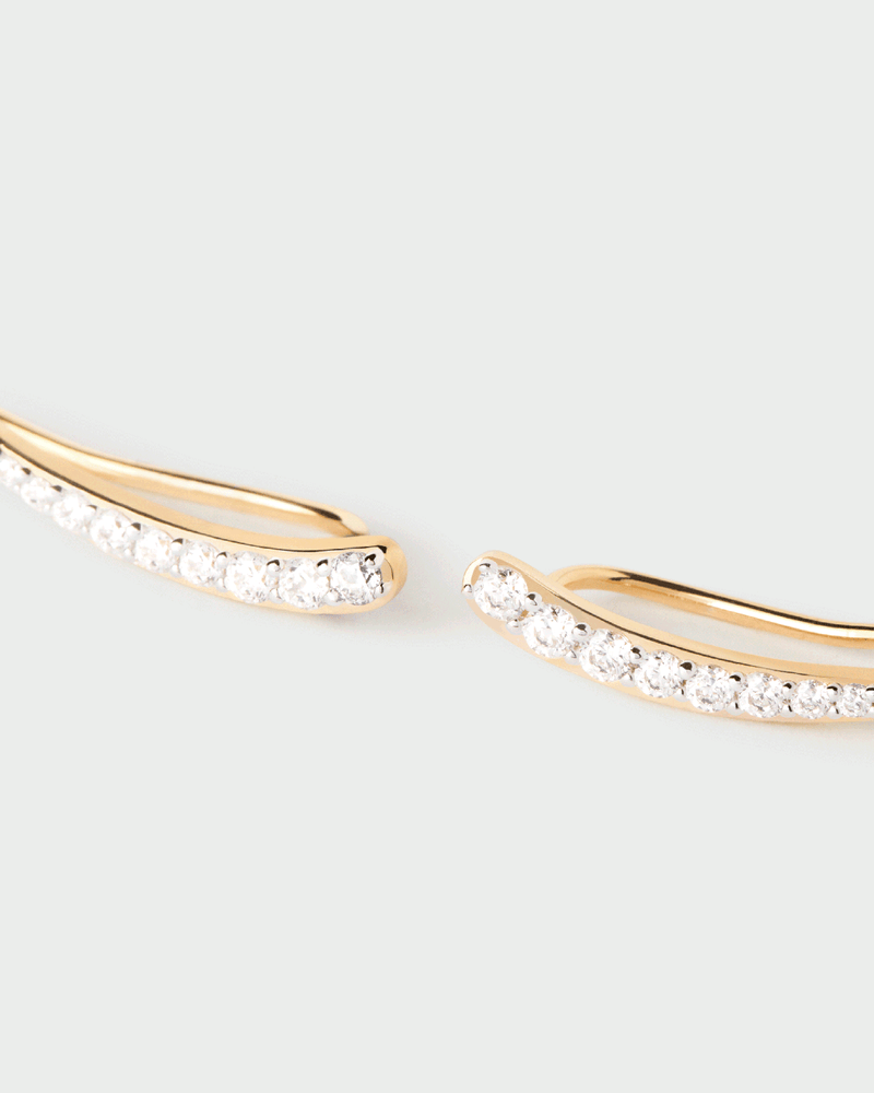 Sleek climbing earrings featuring pavé zirconia in pointed curve