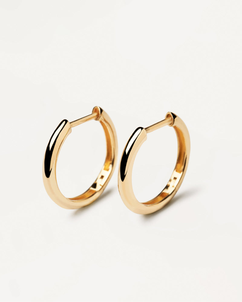 Plain solid yellow gold hoops made of recycled gold