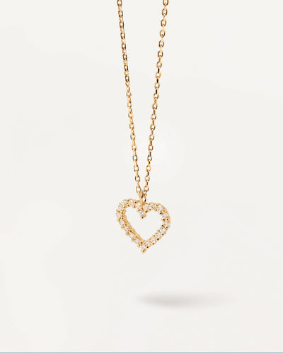 Heart pendant set with white zirconia stones on a 18k gold plated s ...