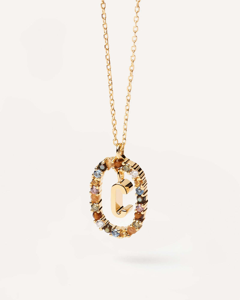 Initial C necklace in gold-plated silver, circled by colorful gemstones