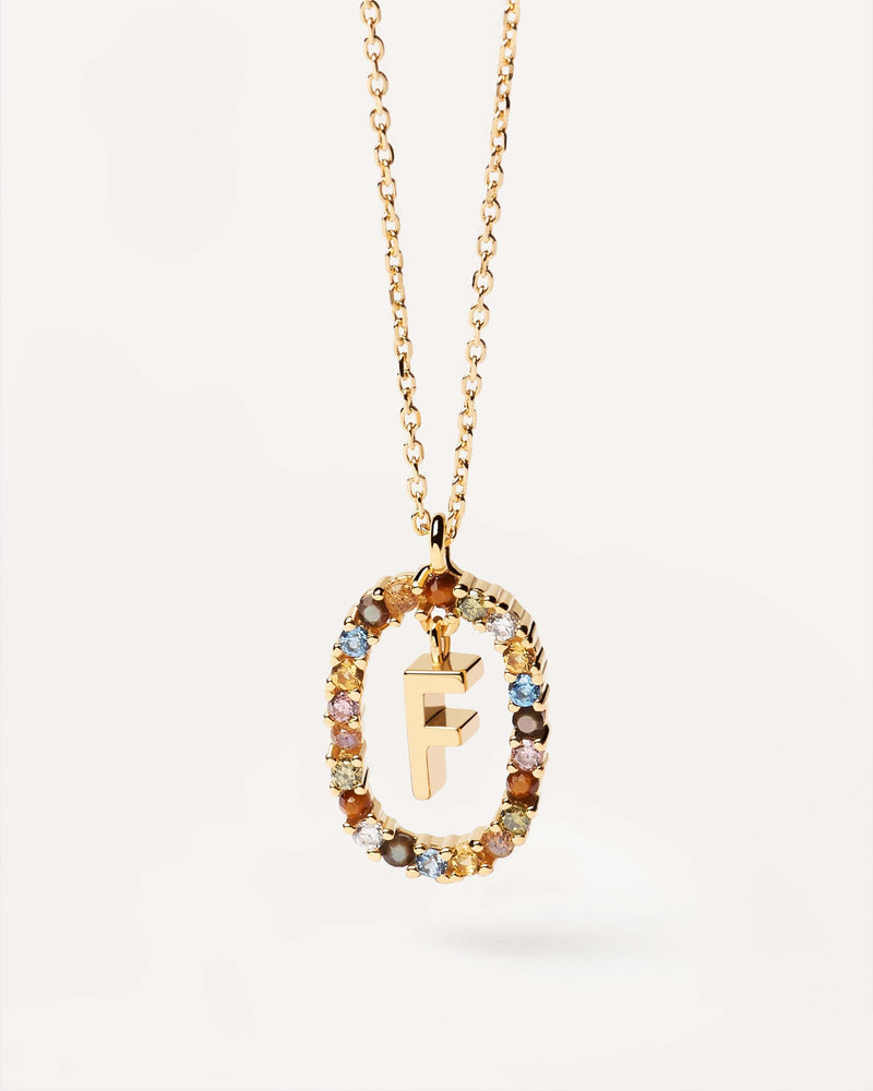 Initial F necklace in gold-plated silver, circled by colorful gemstones