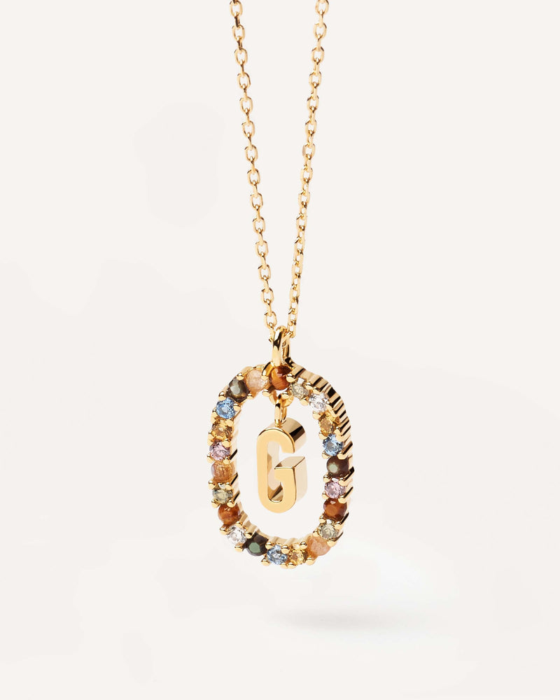 Initial G necklace in gold-plated silver, circled by colorful gemstones