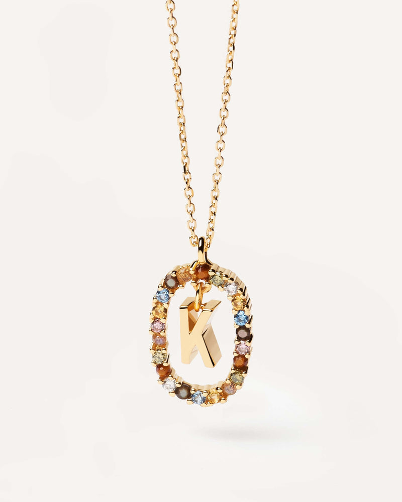 Initial K necklace in gold-plated silver, circled by colorful gemstones