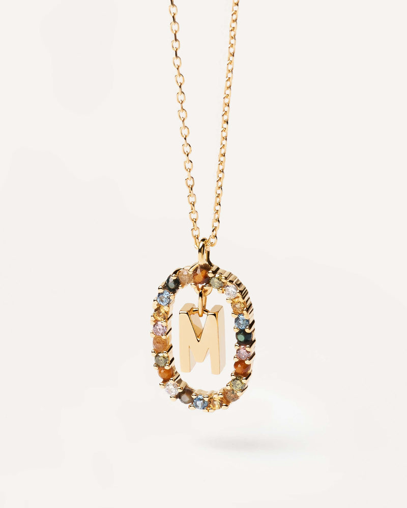 Initial M necklace in gold-plated silver, circled by colorful gemstones