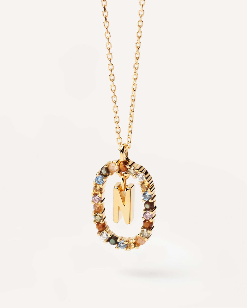 Initial N necklace in gold-plated silver, circled by colorful gemstones