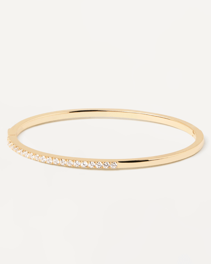 Gold-plated silver hinged rigid bracelet with 2 bands of white zirc ...